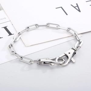 Close-up of silver stainless steel paperclip chain necklace with large lobster clasps
