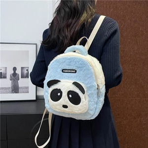 Detailed back view of a plush light blue panda backpack worn by a young child
