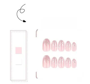 Pink gradient press-on nails with silver glitter, white flower patterns and tiny rhinestones