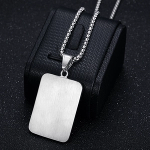 Hip hop silver dollar sign pendant necklace on a premium black textured jewelry box