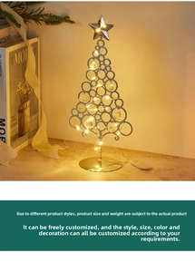 Detail of golden metal LED Christmas tree with crystal pendants and warm glow