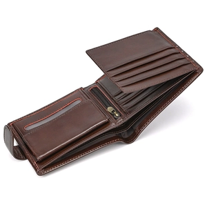 Interior detail of a dark brown leather trifold wallet with multiple card slots and coin pocket