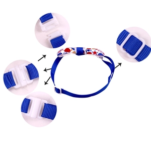 Detail view of adjustable buckle and safety clip on American flag dog bowtie collar
