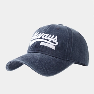 Detail of navy washed cotton baseball cap with white 'Always' embroidery and stitching