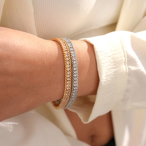 Women's layered metal chain bracelets featuring gold twisted rope and silver rhinestone links
