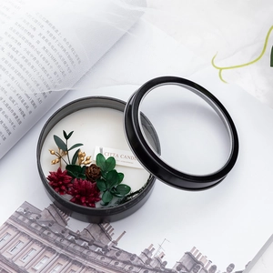 Scented soy candle with dried flowers in a black tin for Christmas decor gift idea