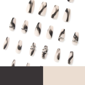 Matte white coffin nails with black ink smoke marble pattern and silver metal ring accents