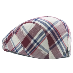 Macro view of colorful cotton plaid beret featuring adjustable side metal buckle detail