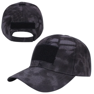 Detail of dark dragon-scale camo tactical cap showing velcro patches and adjustable strap