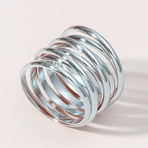Silver multi-layer spiral spring ring featuring a minimalist wrap-around metal design