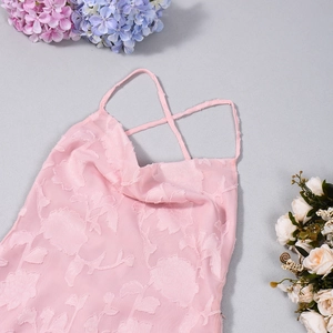 Detail of pink floral embossed fabric with delicate criss-cross spaghetti straps