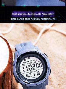 Detailed view of grey-blue digital sports watch with pedometer and large LCD screen