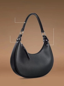 Detail of hobo bag showing high-quality black lychee texture leather and silver buckle