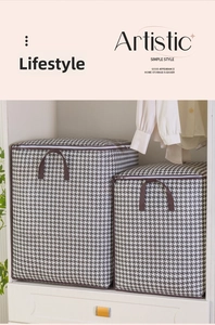 Detail of two-piece houndstooth storage bags with reinforced handles in a closet