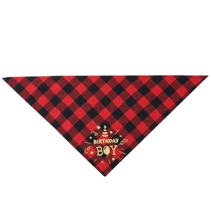 Detail of red buffalo plaid dog bandana with gold Birthday Boy text and star graphics