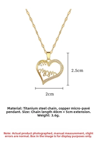 Macro view of gold plated heart pendant with mom engraving and cubic zirconia stones