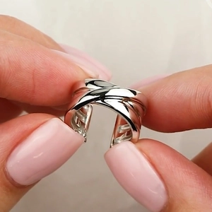 Polished S925 sterling silver ear cuff with a modern geometric multi-layer twisted design