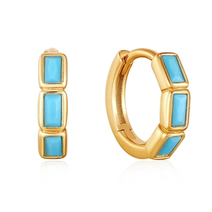 Detail view of gold hoop earrings featuring three rectangular turquoise stones on white background