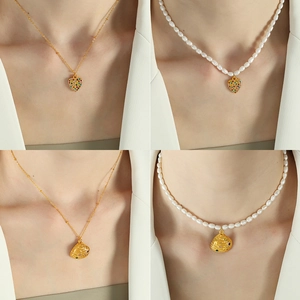 Elegant French pearl necklace set with heart and shell pendants in gold finish