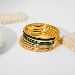 18k gold plated stainless steel bangles set with colorful zircon stones on stone base