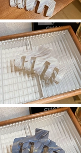 Close-up of large acetate hair claws with elegant marble texture and metal hinge