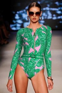 Detail of tropical palm leaf print swimsuit with front zipper and decorative waist belt
