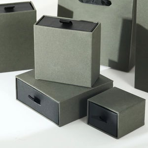 Detailed view of dark green matte jewelry drawer packaging boxes with ribbon pull tabs