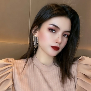 Elegant gold star tassel earrings with long layered metal chains for women