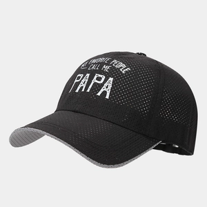 Detail view of breathable mesh texture and embroidered slogan on black baseball cap