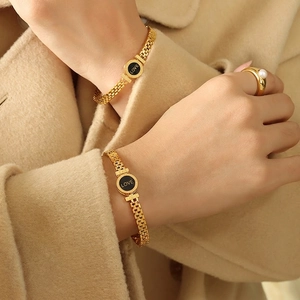 Luxurious 18K gold plated titanium bracelet with Roman numerals and a pearl ring set
