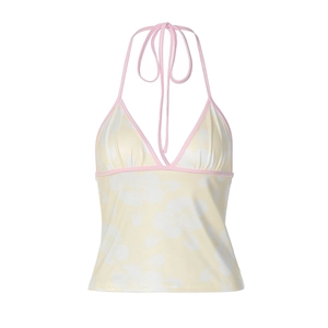 Detailed view of floral halter top with pink contrast trim and adjustable neck ties