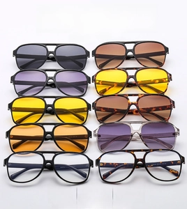 Detail view of ten colorful aviator sunglasses in a classic retro double-bridge design