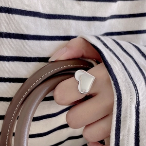 Chic 925 sterling silver ring featuring a large polished heart design on finger