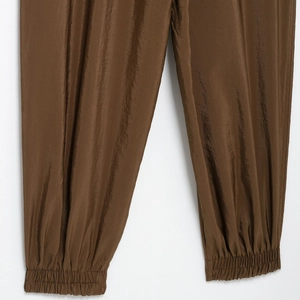 Women's metallic brown safari leisure pants with stylish elastic cuffs and drawstring waist