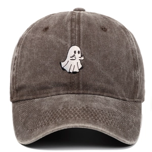 Macro detail of ghost embroidery on vintage washed cotton baseball cap with retro finish