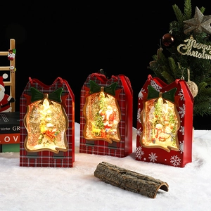 Lighted musical Christmas water lanterns with Santa and snowman scenes in red plaid gift boxes