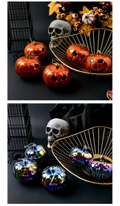 Close-up of 8cm Halloween pumpkin ornaments in orange and iridescent finish with gold cords