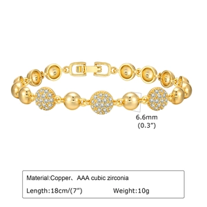 Detailed view of copper gold bracelet with AAA cubic zirconia pavé discs and metal beads