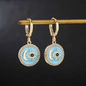 18K gold plated huggie hoops with celestial eye and crescent moon enamel pendants