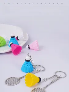 Close-up of colorful mini badminton racket and shuttlecock pendants for keychains