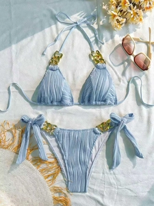 Light blue ribbed bikini set with gold chain details and halter neck ties for beachwear