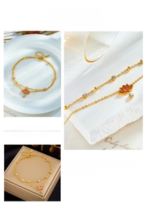 Detail of pink lotus pendant and double layer golden chain anklet with zircon stones