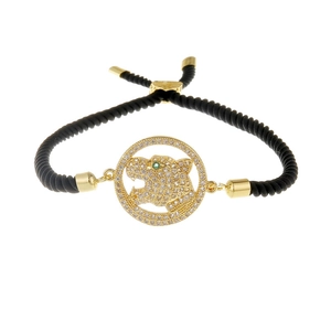 Bracelet tête de léopard ajustable doré avec cristaux blancs et cordon tressé noir