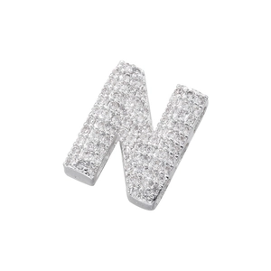 Macro detail of silver plated letter N pendant with sparkling zircon micro-pave setting