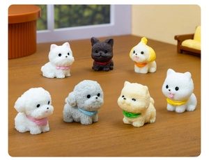 Detailed view of seven miniature resin dog figurines with colorful bibs on a wooden surface