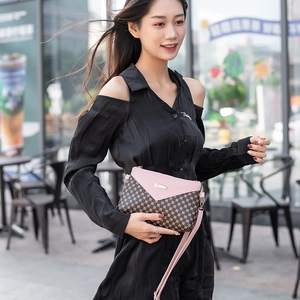 Pink and brown patterned leather crossbody bag with adjustable strap and gold hardware