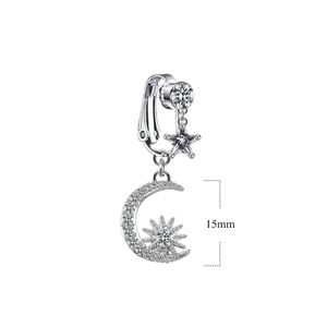 Detail shot of silver moon and star navel ring with 15mm size scale and clear gems