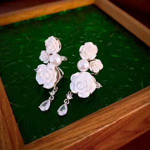 Elegant white rose floral earrings with pearl accents and teardrop zircon pendants