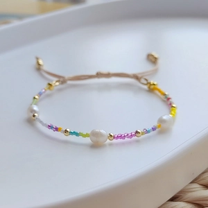 Bohemian handmade bracelet with colorful beads, baroque pearls, and adjustable cord