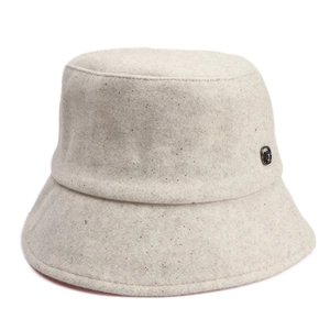 Detailed view of the wool blend texture with shimmering silver threads and a metal buckle